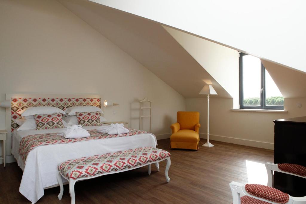 Кровать или кровати в номере Hotel Casa Palmela - Small Luxury Hotels of The World, Hotel & Villas