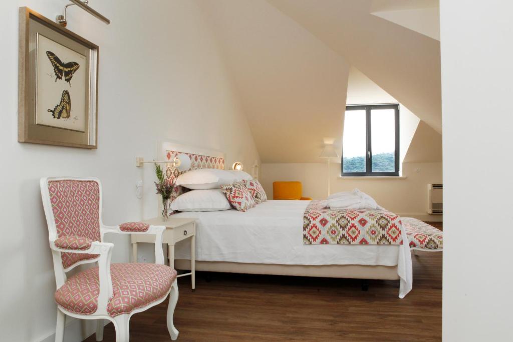 Кровать или кровати в номере Hotel Casa Palmela - Small Luxury Hotels of The World, Hotel & Villas