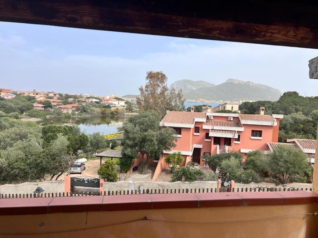 a view from a window of a house with a lake at Orizzonti 32 in Golfo Aranci