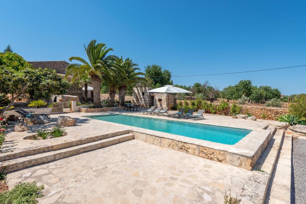 an image of a swimming pool in a yard at Son Xigala in Manacor