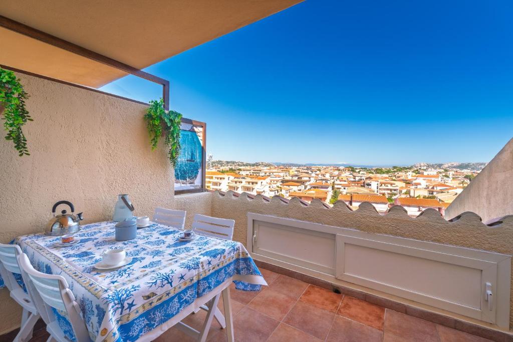 a dining room with a table and a view at L'incanto in Palau