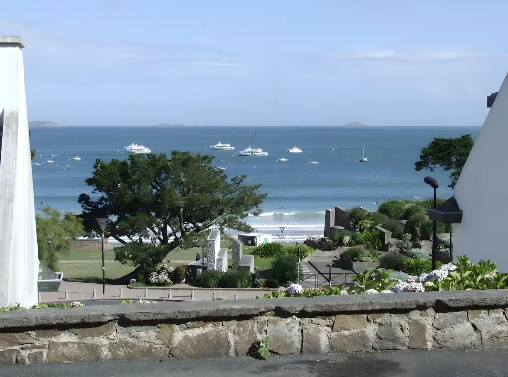 a view of the ocean from a building at Ti Bihan - Perros Guirec in Perros-Guirec
