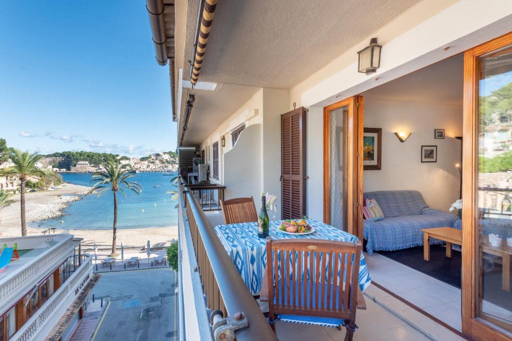 a balcony with a table and a view of the beach at Delta 3 in Sóller