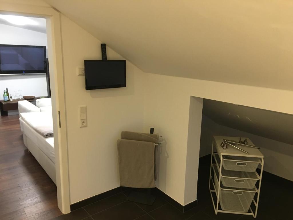 TV a/nebo společenská místnost v ubytování Business Appartements