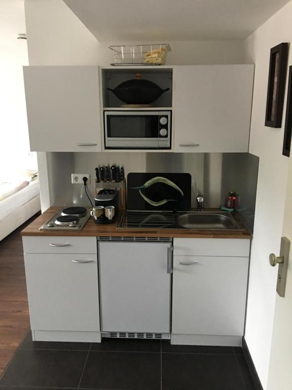 Kuchyň nebo kuchyňský kout v ubytování Business Appartements