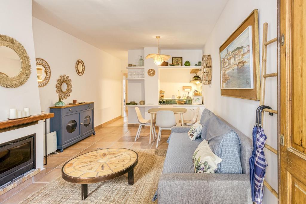 a living room with a couch and a table at Calella Pallafrugell in Palafrugell
