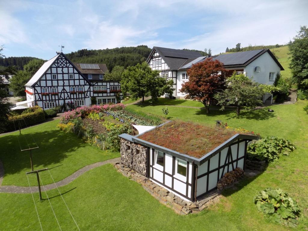an aerial view of a house with a yard at Ferienhof Bieke in Finnentrop