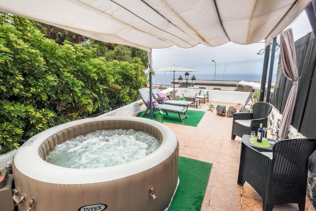 a hot tub on the balcony of a house at Casa Amparo in Icod de los Vinos