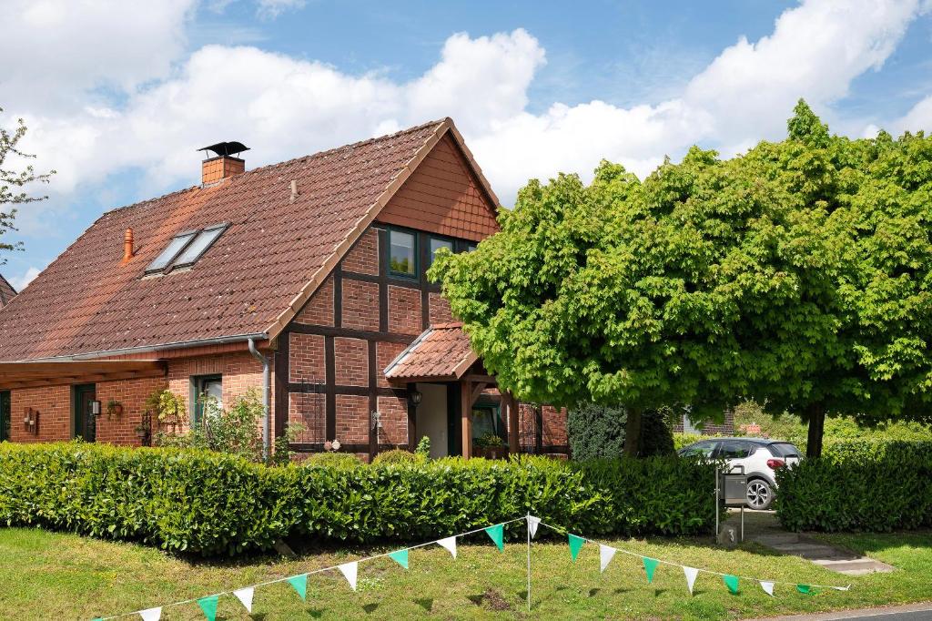 a house with a banner in front of it at Ferienhaus Thomas in Colnrade