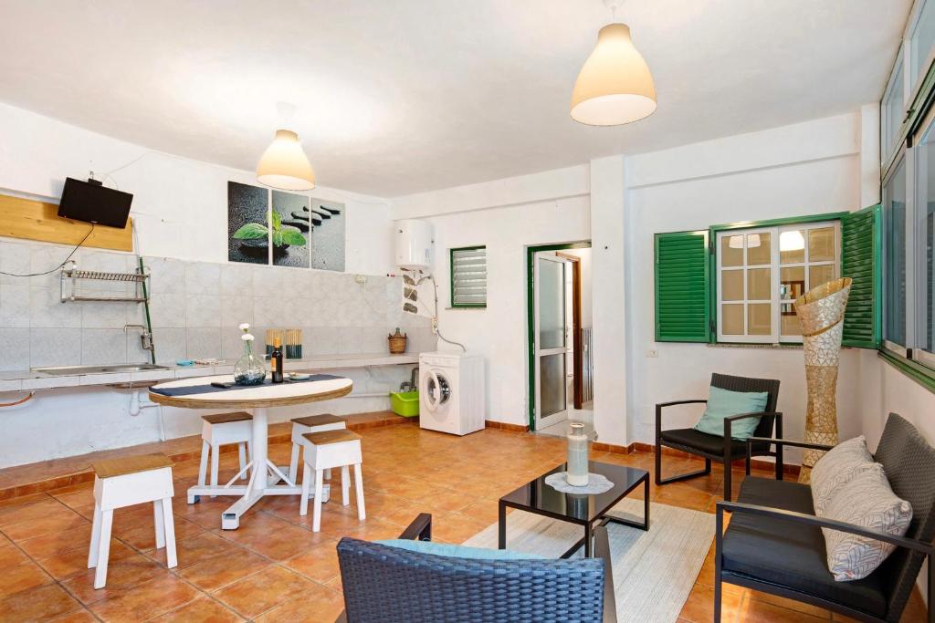 a living room with a table and chairs at Finca Candelario sc de La Palma in Santa Cruz de la Palma