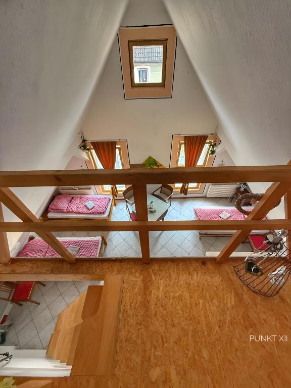 an overhead view of a attic room with four beds at Wohnung 2 in Burghaslach