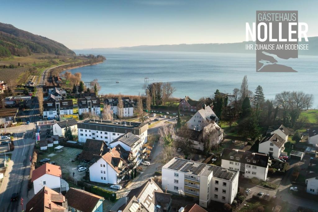 an aerial view of a city with the water at Gästehaus Noller in Bodman-Ludwigshafen