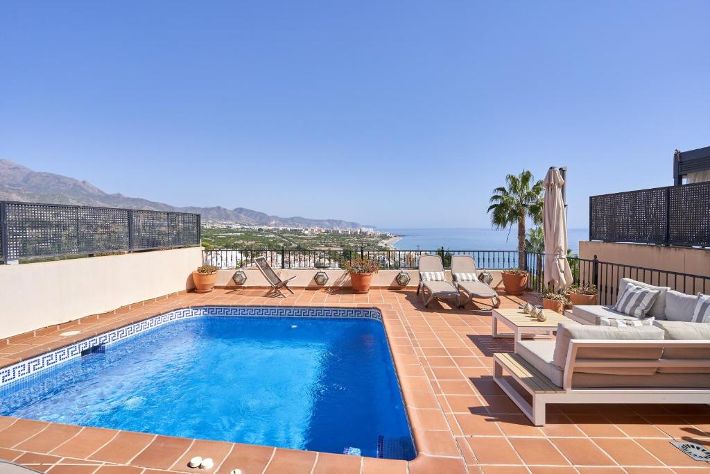 a swimming pool on top of a building at Balcon Bella Vista in Nerja