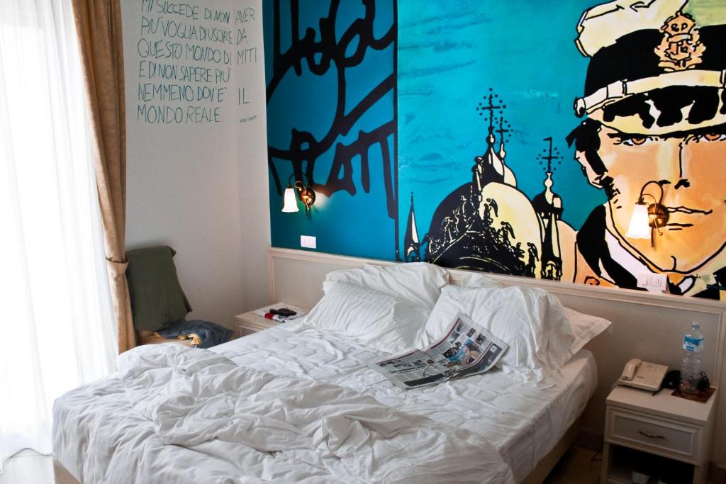 Postel nebo postele na pokoji v ubytování Sovrana Hotel & SPA