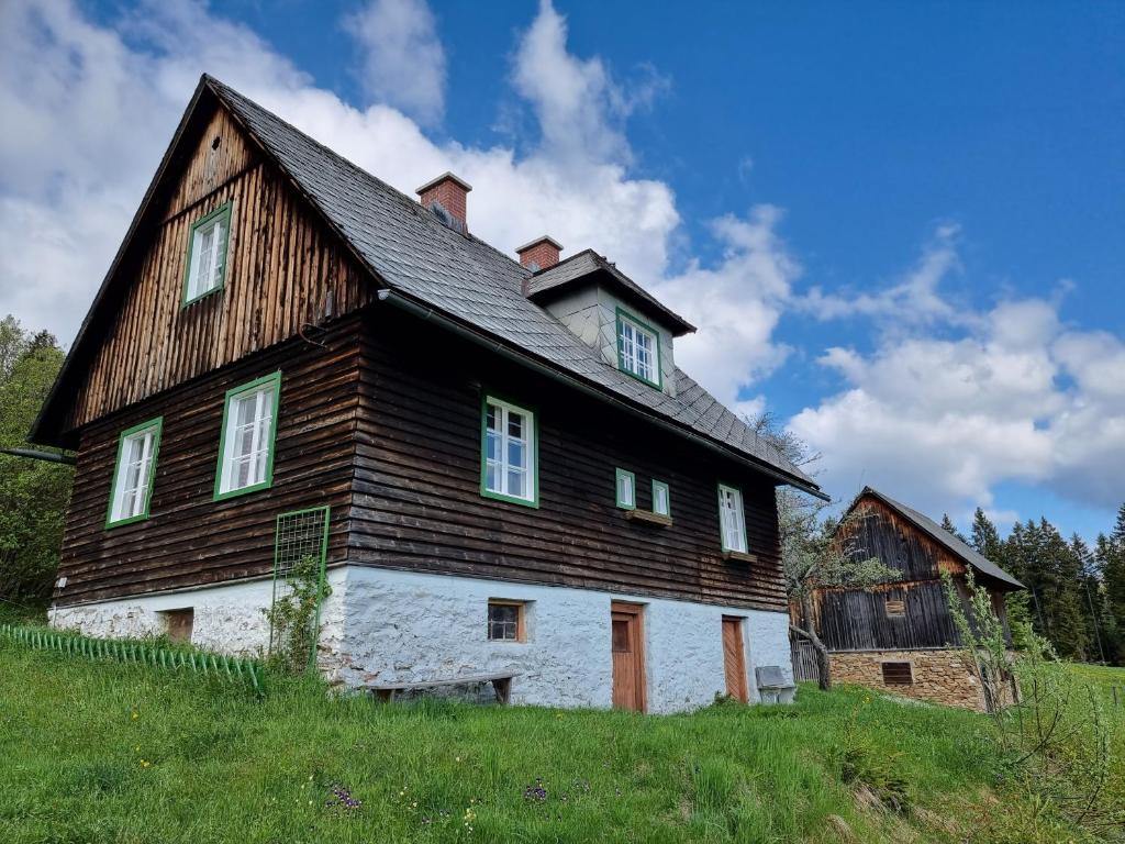 a large wooden house on top of a hill at Zankl in Lavamünd