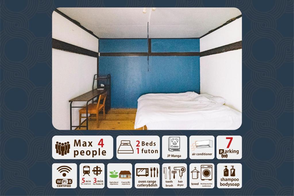 a room with a bed with a blue wall at hinatabocco guesthouse in Miyaki