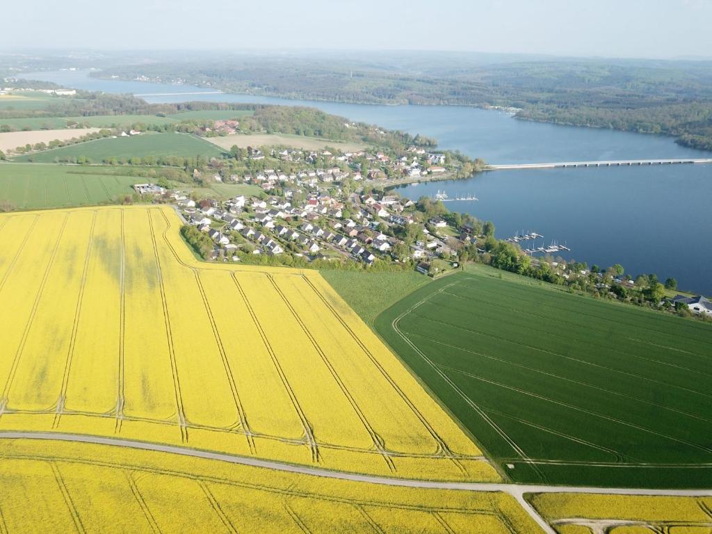an aerial view of a field and a river at Ferienhaus Knappstein in Möhnesee