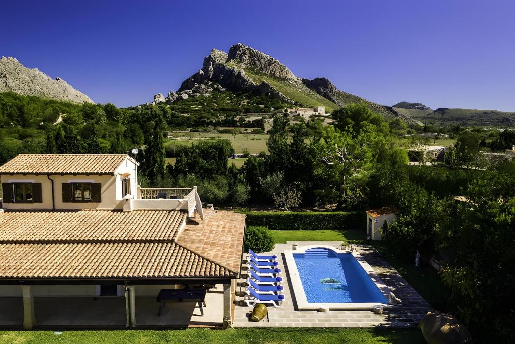 an aerial view of a house with a swimming pool at Villa Barraca in Pollença