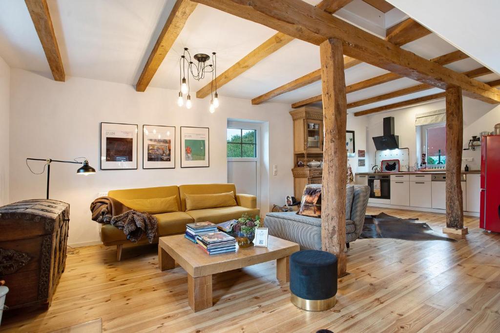a living room with a couch and a table at Peene Hus in Hohen Demzin