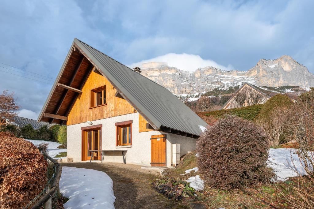 a house in the mountains with snow on the ground at Chartrousin in Saint-Hilaire