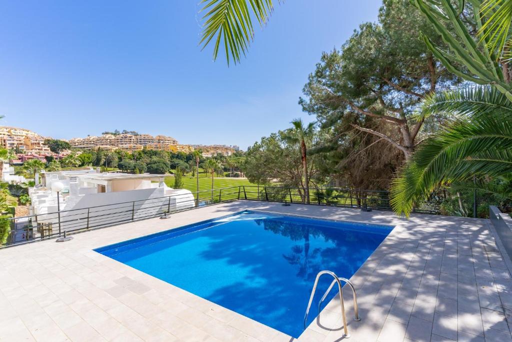 a swimming pool in the backyard of a house at Ganso golf in Benalmádena