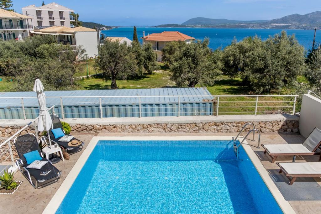 a villa with a pool and a view at Evagelia Luxury Apartment 2 in Nikiana