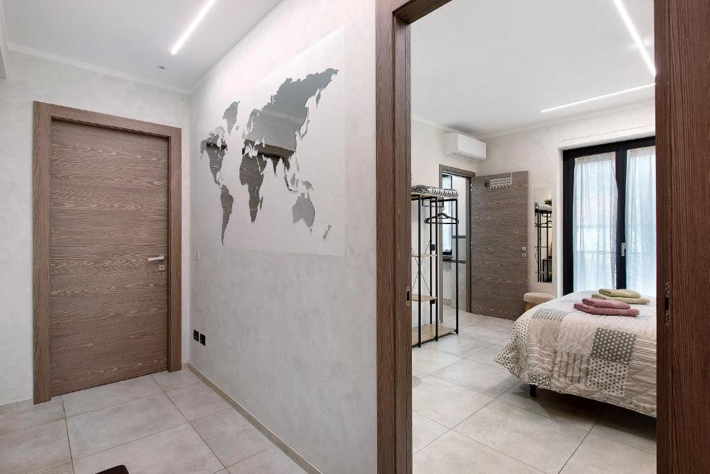 a bedroom with a bed and a door in a room at Double room - Myaostaproject in Aosta