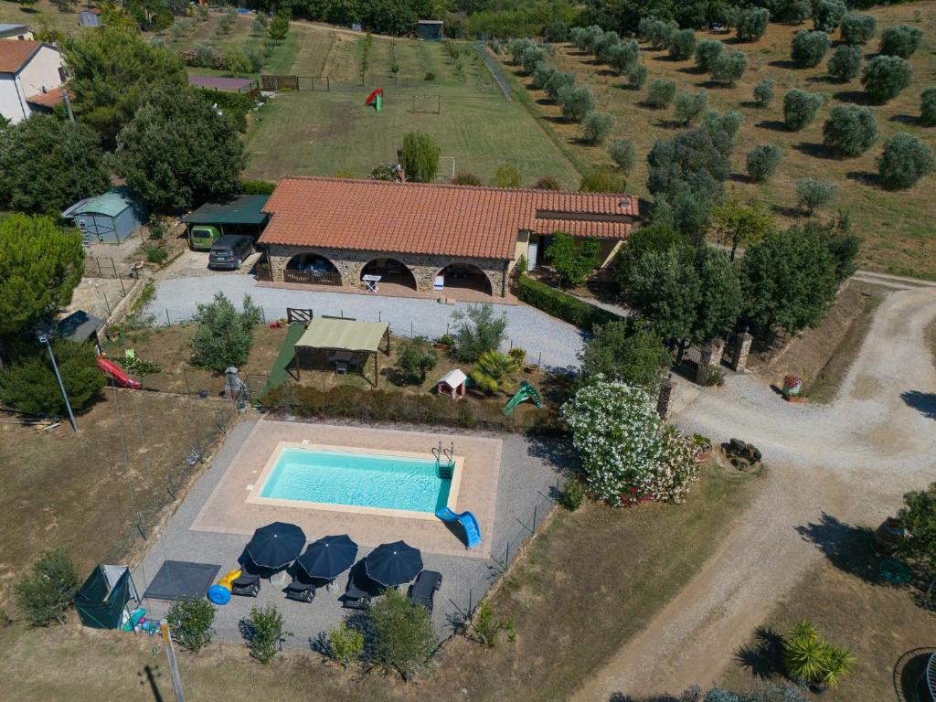 an aerial view of a house with a swimming pool at Podere Chinco - Gavorrano in Gavorrano