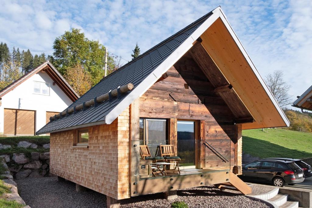 a tiny house with a pitched roof at Schwarzwaldchalet Holzperle in Lenzkirch