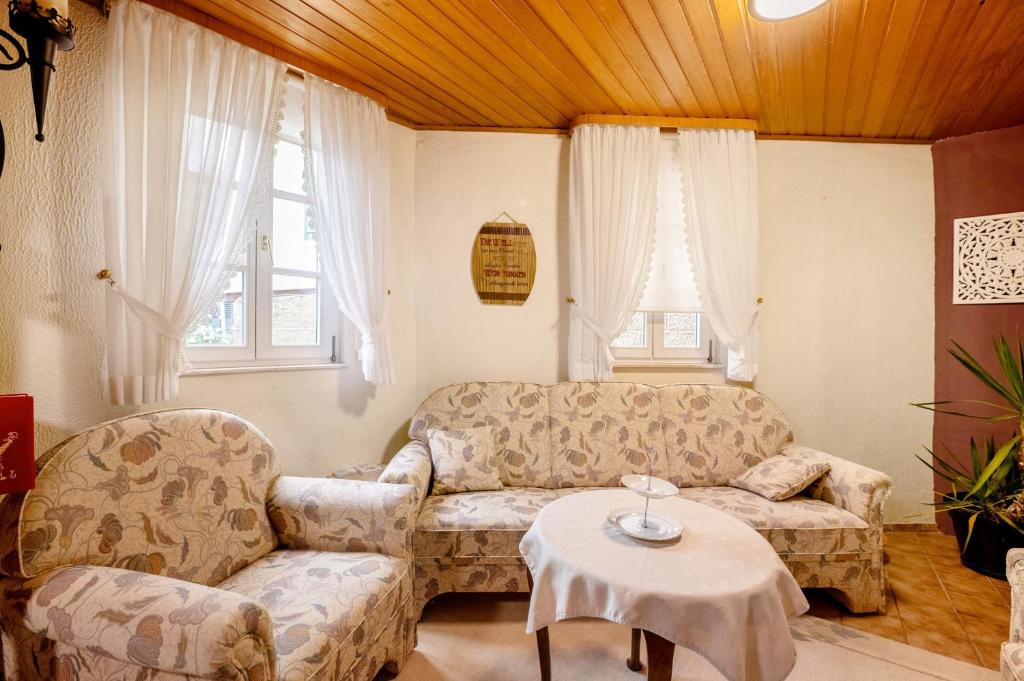 a living room with a couch and a table at Am Fischertor in Bad Kreuznach