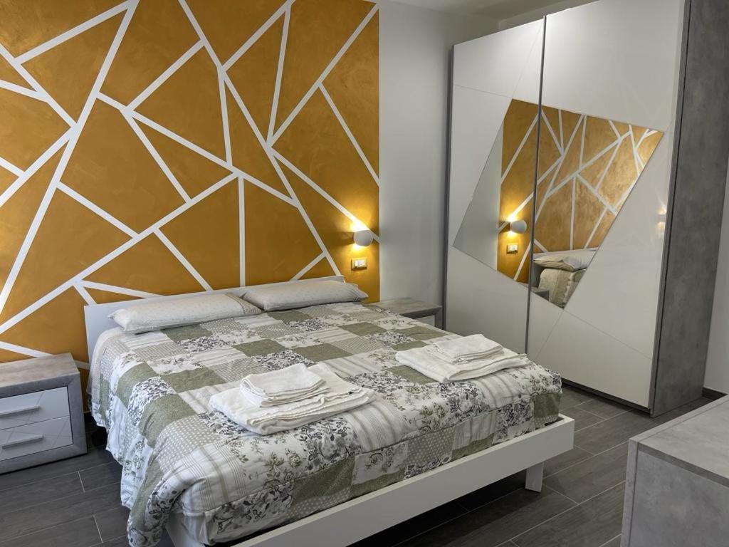 a bedroom with a bed and a large mirror at Il Paradiso Holiday in Ravenna