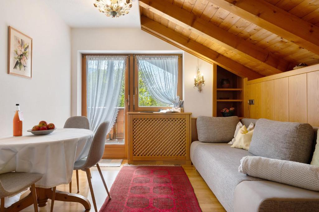 a living room with a couch and a table at Mayr Apartments Fünf in Plaus
