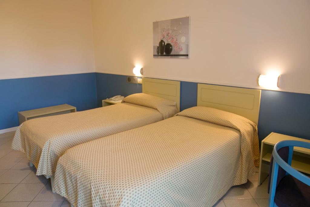 Postel nebo postele na pokoji v ubytování Hotel Salsello