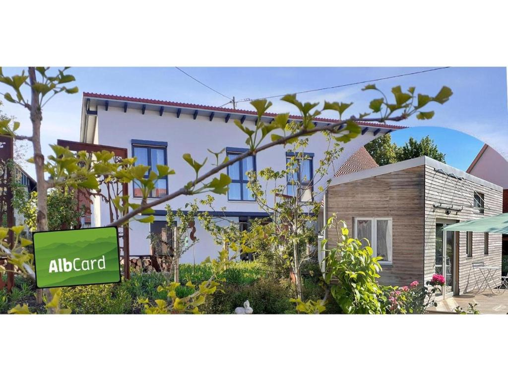 a house with a sign in front of it at Gästehaus 26 I 2 in Bad Urach