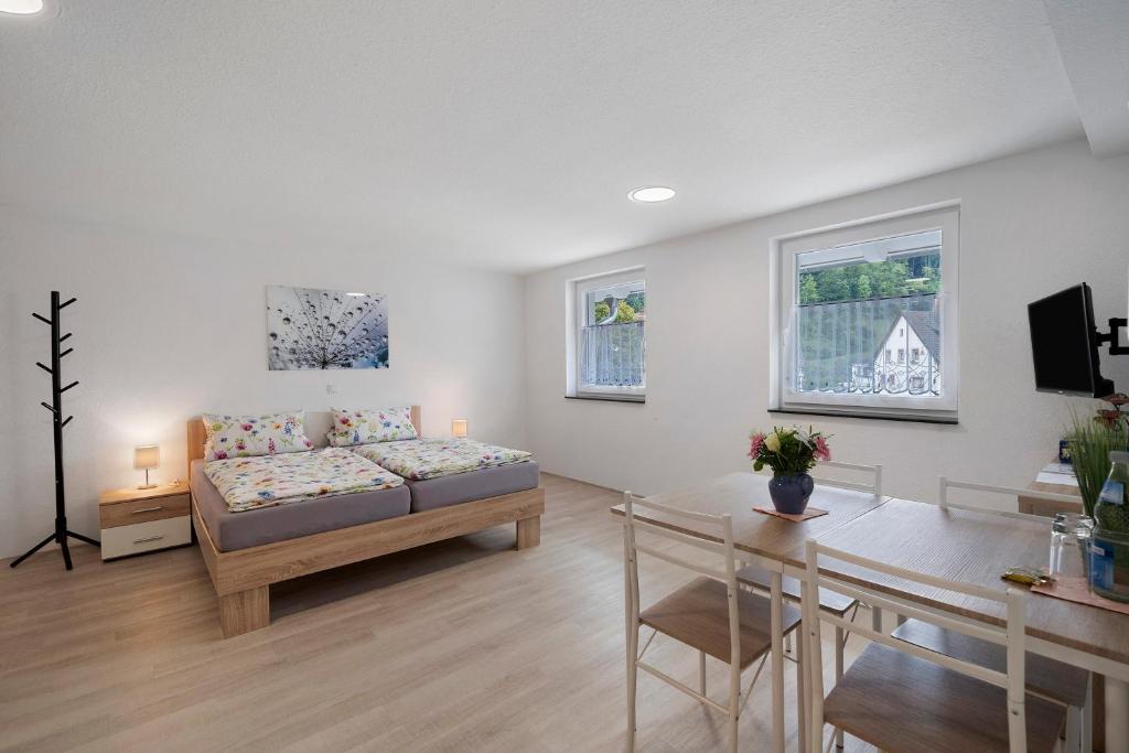 a living room with a couch and a table at Casa Karlsplatz in Freiamt