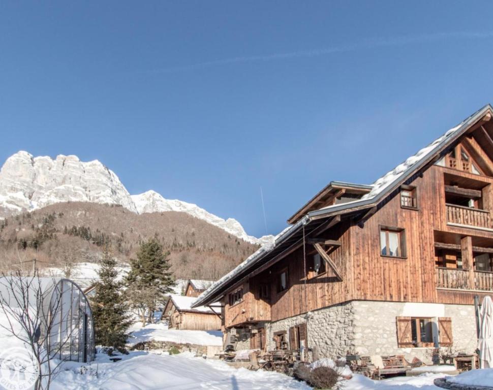 a log cabin in the mountains in the snow at Chalet Arclosan - Saint-Ferréol in Saint-Ferréol