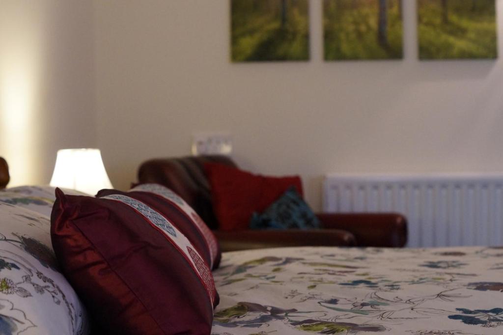 Postel nebo postele na pokoji v ubytování Ty Uchaf