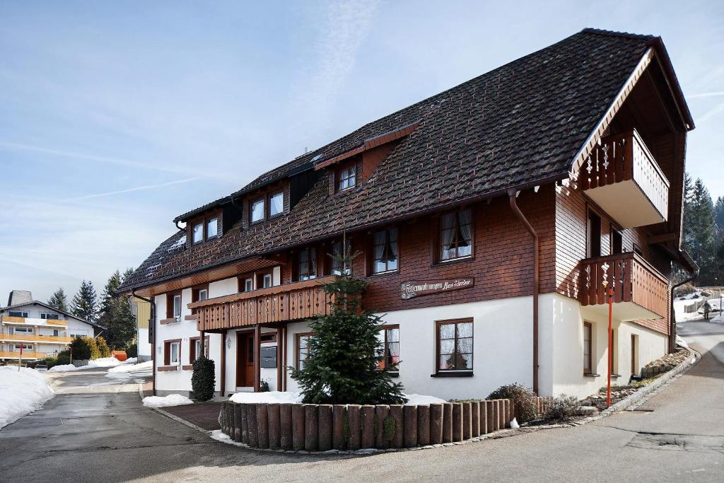 a large building with a wooden roof at Ferienhaus Schwörer in Feldberg