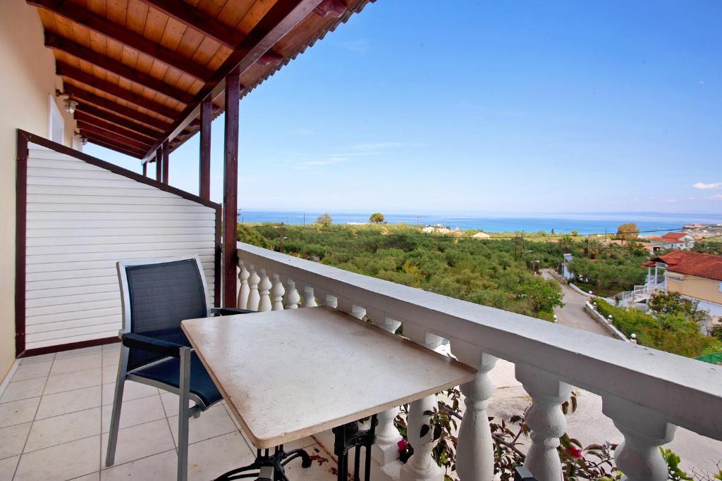 a balcony with a table and a view of the ocean at Zante View Family Studio 2 in Tsilivi