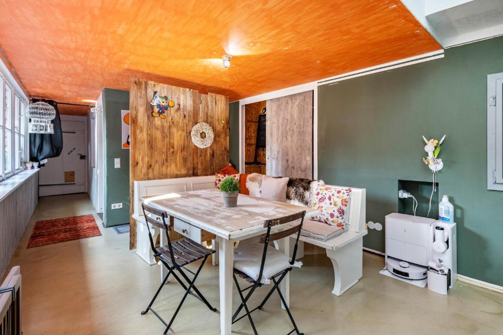 a dining room with a table and a couch at Haus nähe Schweiz in Kandern