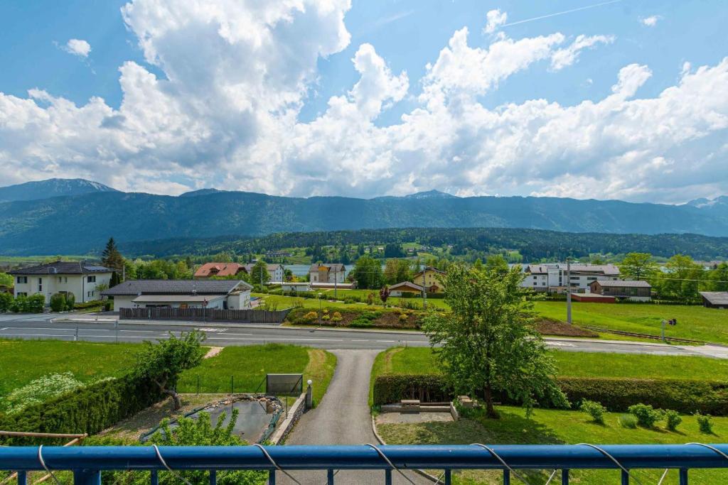 a view of a road with mountains in the background at Appartment Isabelle - Kamille in Lake Pressegg