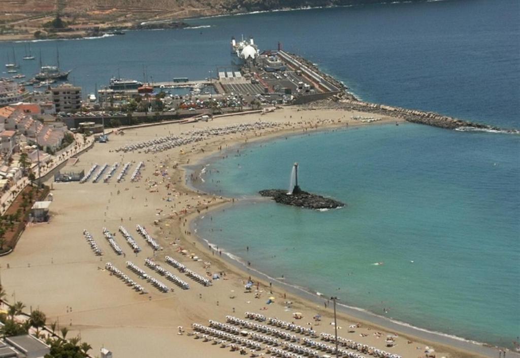 an aerial view of a beach with a crowd of people at Beach apartment in Los Cristianos in Los Cristianos