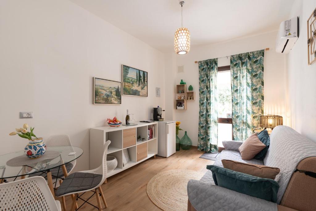 a living room with a couch and a table at Civico17 in Santa Ninfa