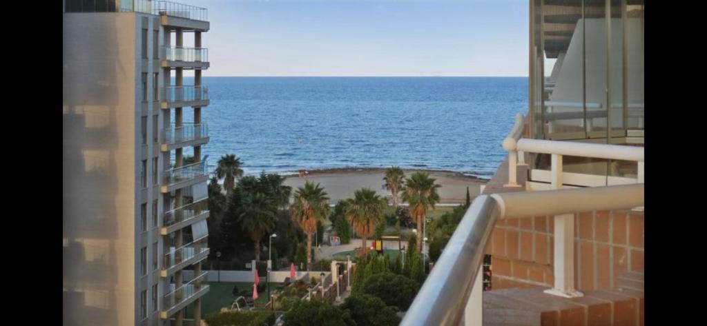a view of the ocean from a balcony of a building at Escapada Ideal en Oropesa in El Borseral