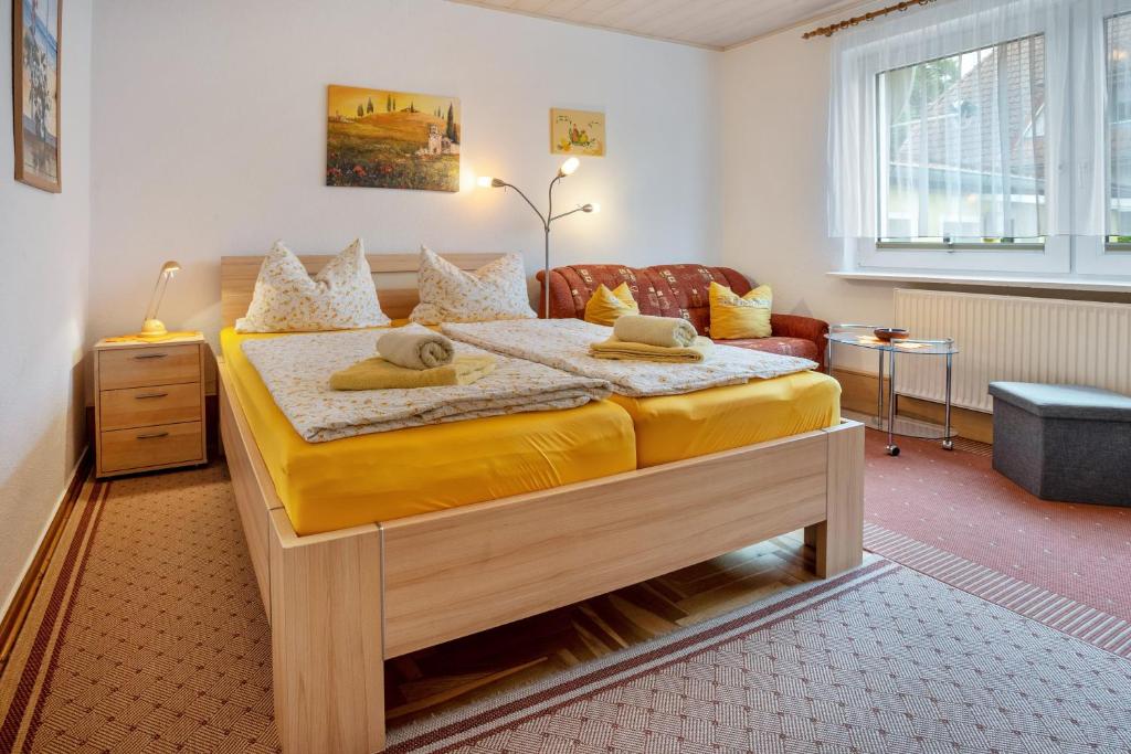 a bedroom with a large bed in a room at Prerow Am Deich - Ferienwohnung 2 in Prerow