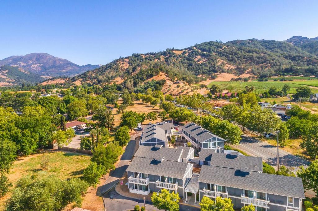 an aerial view of a house with mountains in the background at UpValley Inn & Hot Springs, an Ascend Collection Hotel in Calistoga