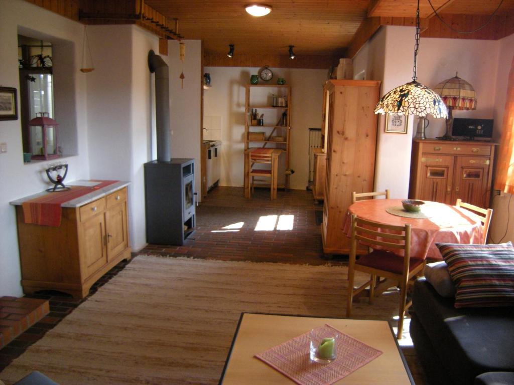 a living room with a kitchen and a dining room at Rhön-Antik in Dipperz