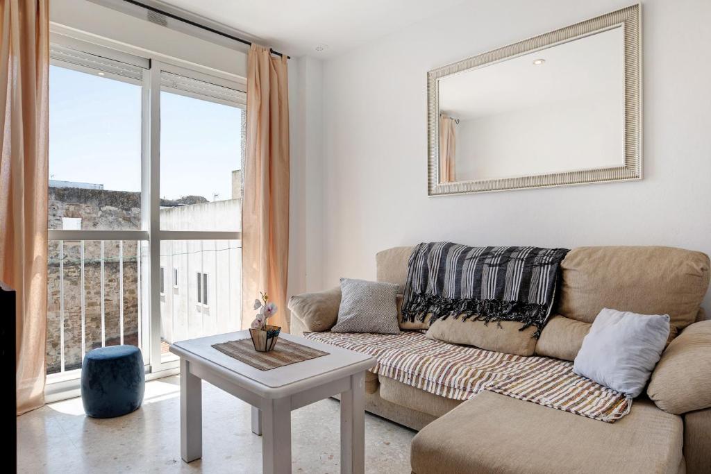 a living room with a couch and a table at Surfer Tarifa in Tarifa