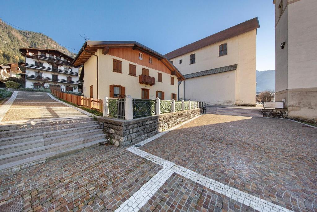 a brick walkway in front of a building at Villa Maria Auronzo in Auronzo di Cadore