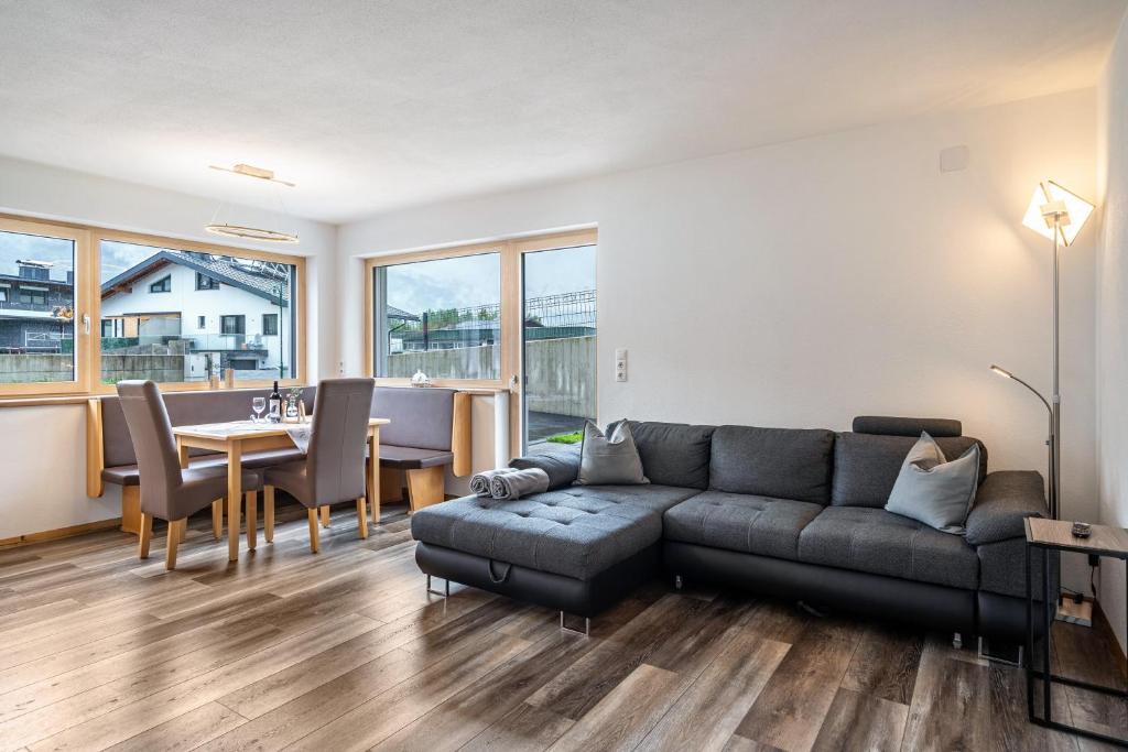 a living room with a couch and a table at Steinwender in Kaltenbach
